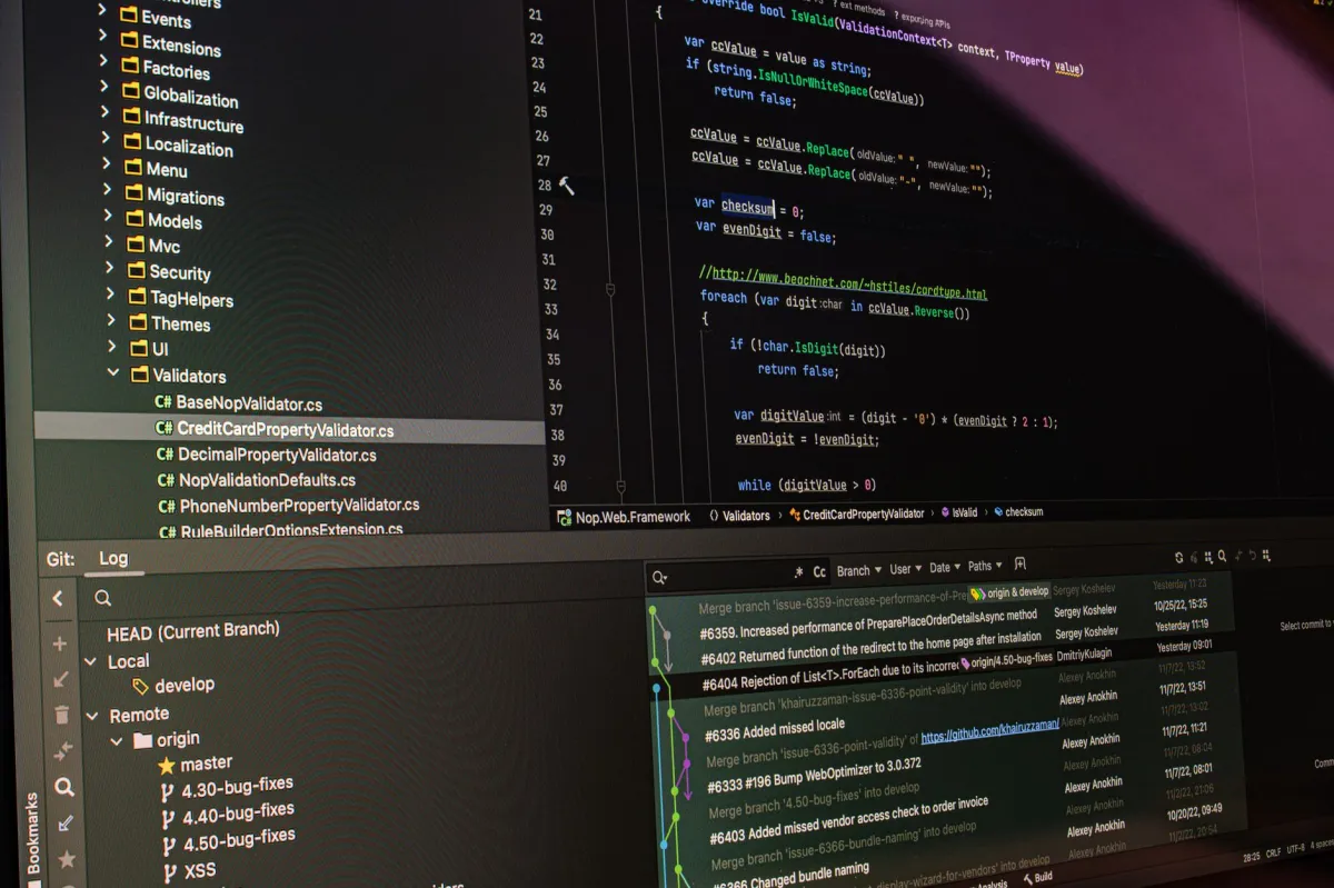 Close-up of software development tools displaying code and version control systems on a computer monitor.