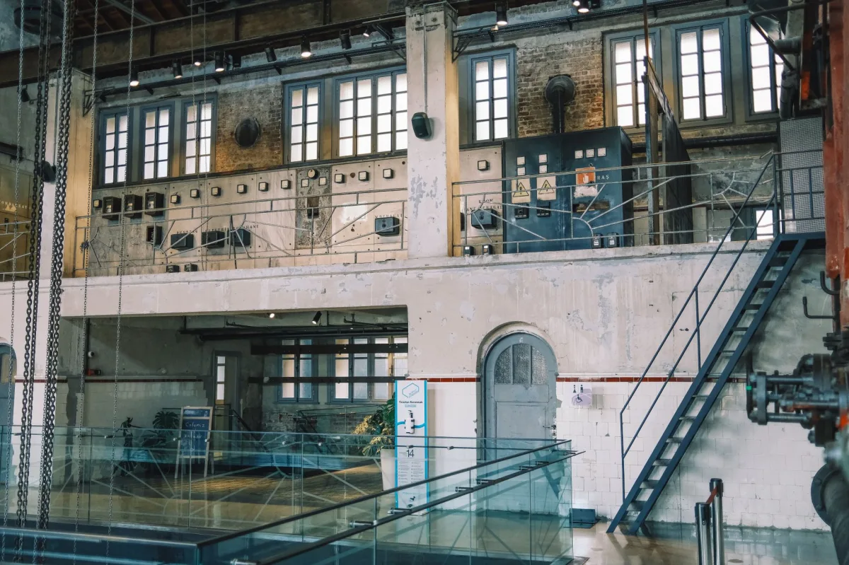 An industrial space with exposed brick walls and vintage machinery, ideal for design inspiration.